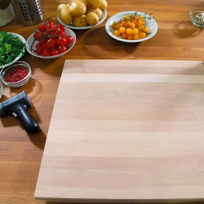 Alfa Beechwood Pastry Board 50x50cm on a wooden table with various vegetables and thermometer.