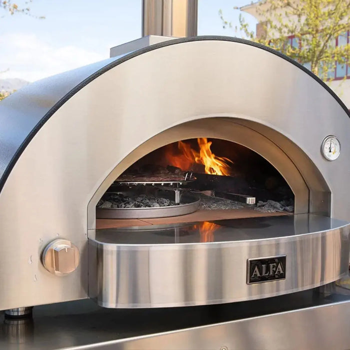 Stainless steel outdoor pizza oven with fire inside, brand 'ALFA' visible