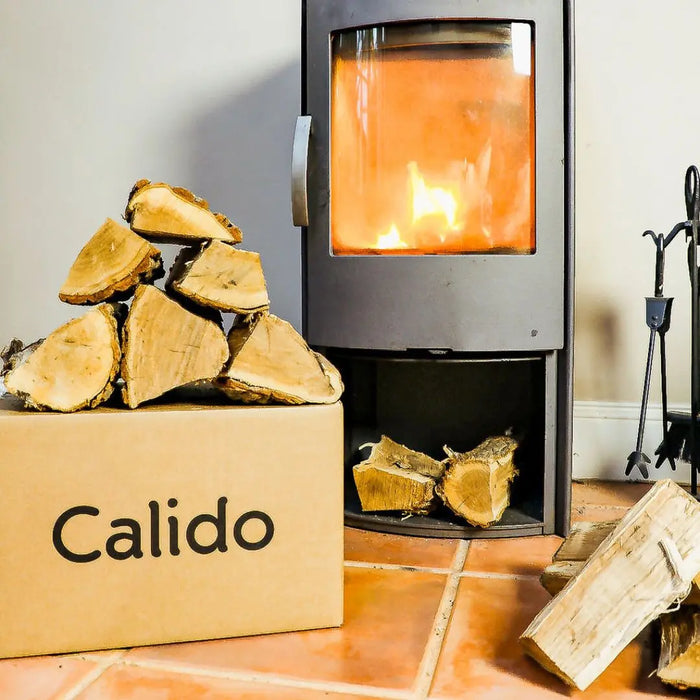 kiln dried oak logs in front of a stove