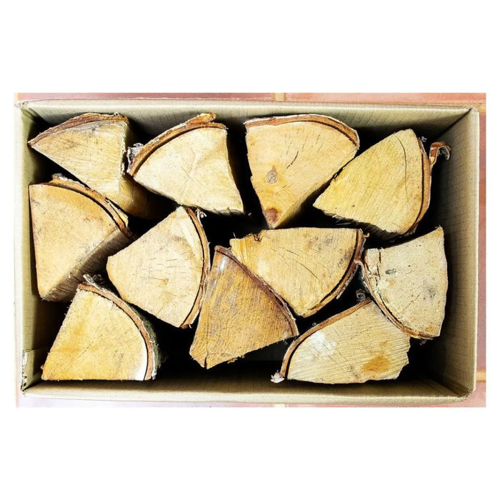 Kiln dried birch logs in a box