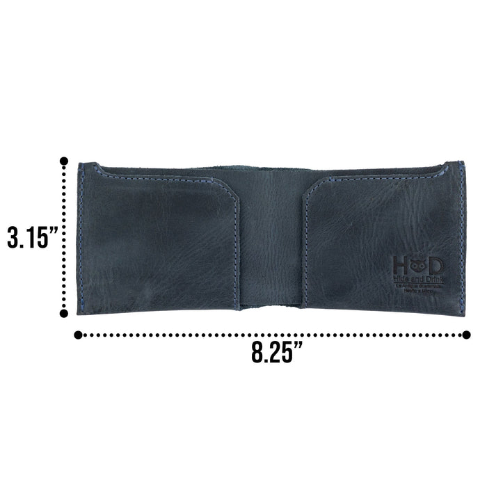 Hide & Drink Classic Wallet packaging including wallet and care instructions, emphasizing its artisan craftsmanship. Classic Wallet, Card Organizer, Money Holder, Vintage Pocket, Travel Accessories, Full Grain Leather, StockyardX, Small Batch Production, Hand Cut, Hand Sewn, Fire Branded, Artisan, Handmade in La Antigua Guatemala & Oaxaca Mexico.