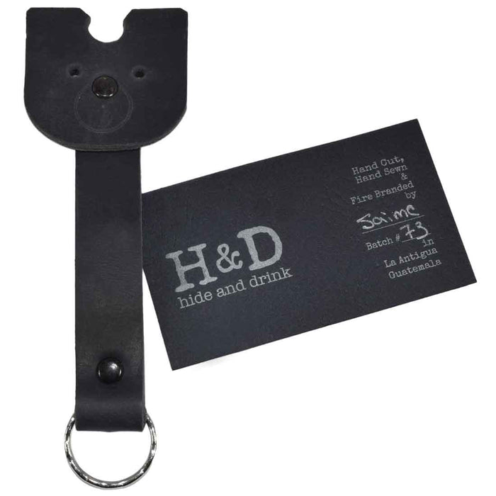 Doggy Fob by Hide & Drink featuring a black Full Grain Leather Critter Keychain, designed for practicality and style for dog lovers. Critter Keychain Dog Key Ring Pet Fob, Full Grain Leather, StockyardX, Small Batch Production, Hand Cut, Hand Sewn, Fire Branded, Artisan, Handmade in La Antigua Guatemala & Oaxaca Mexico.
