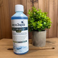 Bottle of eco3spa Hot Tub Cleaner on a wooden surface with a plant in the background