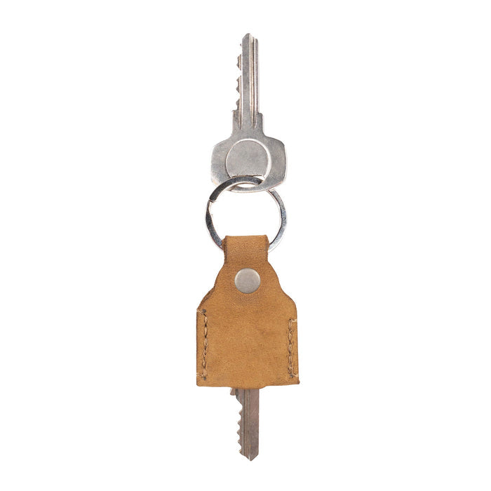 Hide & Drink Key Holder in dark navy leather, designed for practicality and style. This Key Holder functions well as a Keychain Organizer and emergency coin pouch, showcasing the beauty of Full Grain Leather. Handmade in La Antigua Guatemala & Oaxaca Mexico, celebrating artisan craftsmanship.