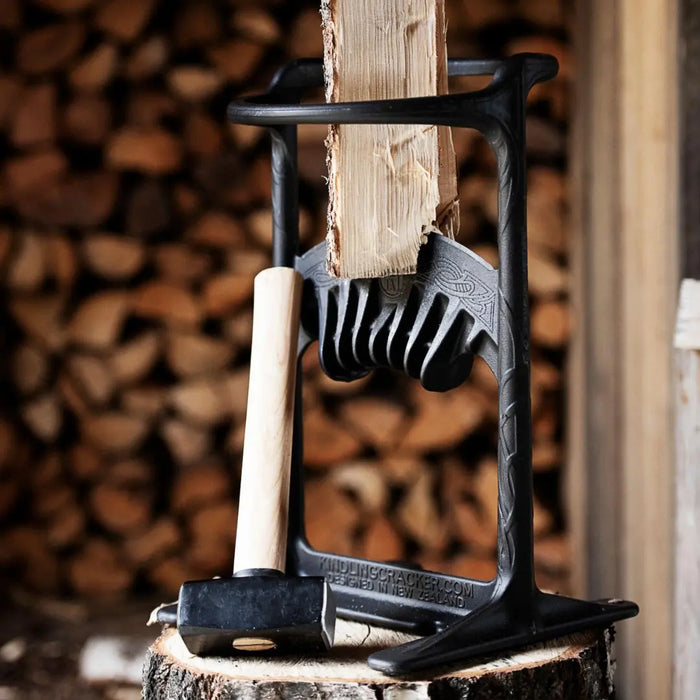Kindling Cracker King on a log with the hammer