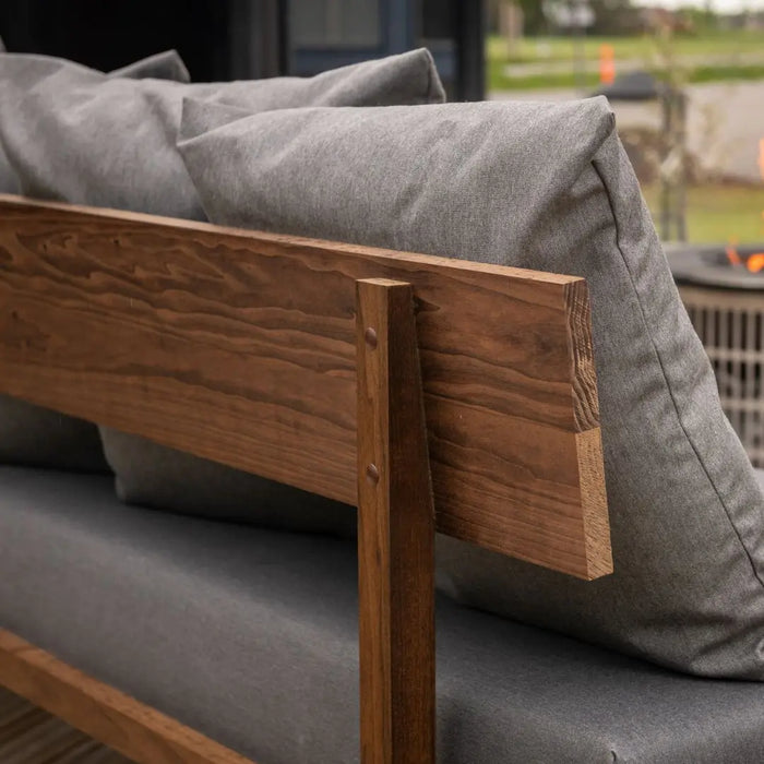 Kirami finvision sofa backrest in use with grey cushions up close