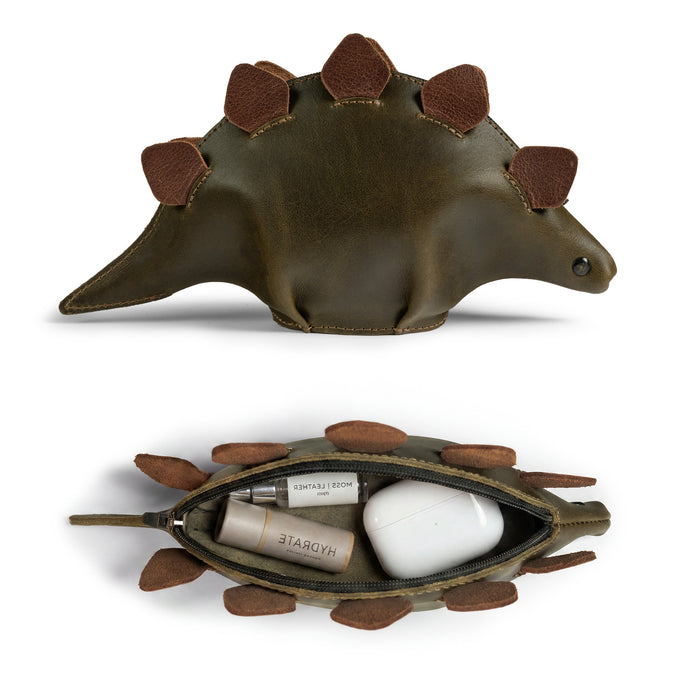 Open view of the Leather Dinosaur Stegosaurus Pouch by Tudi Frudi, highlighting its functionality as a change purse and organizer for cosmetics. This artisan product features a dino-shaped design, perfect for storing small items, reflecting small batch production and hand-cut details from La Antigua Guatemala and Oaxaca, Mexico.