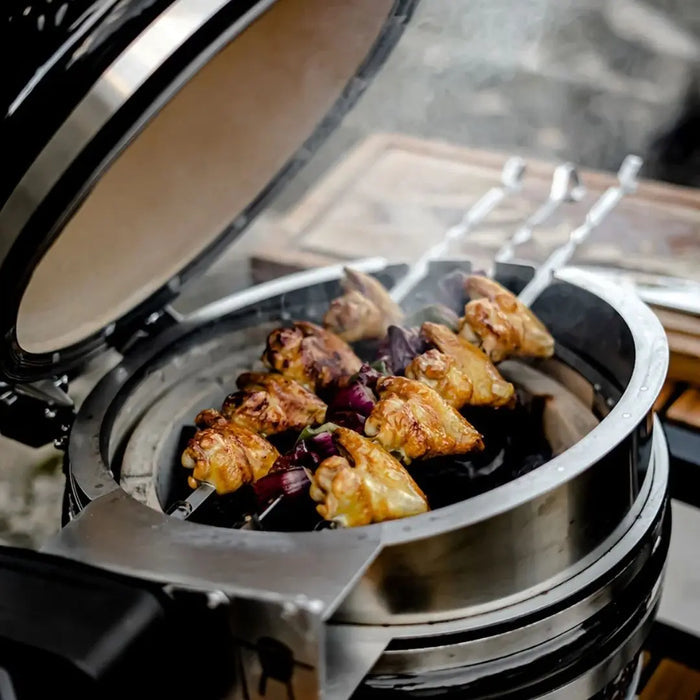 Monolith Kamado Grill Rotisserie closeup with chicken and vegetables