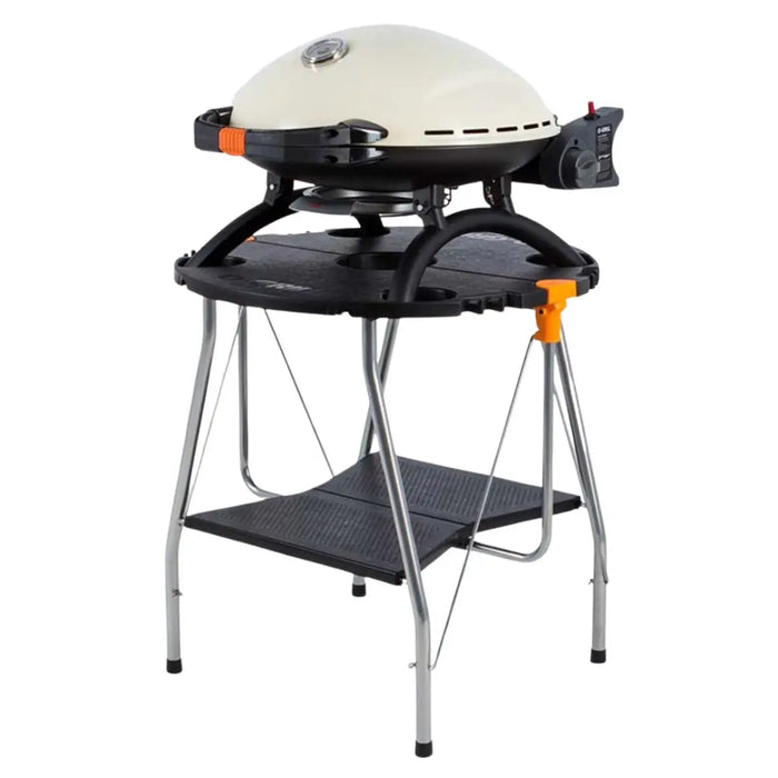 O-Grill portable grill bbq in cream on folding table on a white background