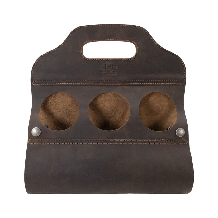 Hide & Drink's Six Bottle Caddy, crafted from Full Grain Leather, showcasing a durable and stylish Beer Holster for Bike. This artisan handmade item reflects Small Batch Production methods and features meticulous hand cut and hand sewn details, perfect for any occasion.