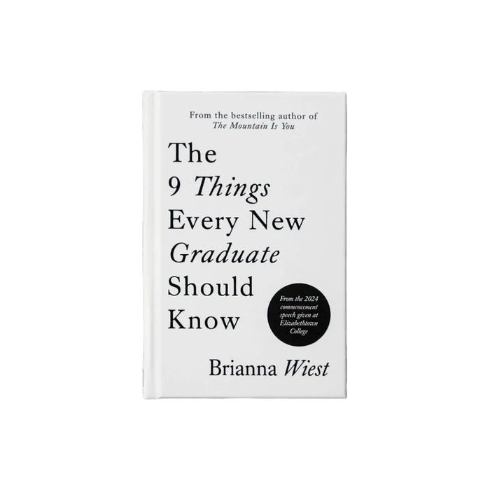 Book titled 'The 9 Things Every New Graduate Should Know' by Brianna Wiest on a textured gray surface