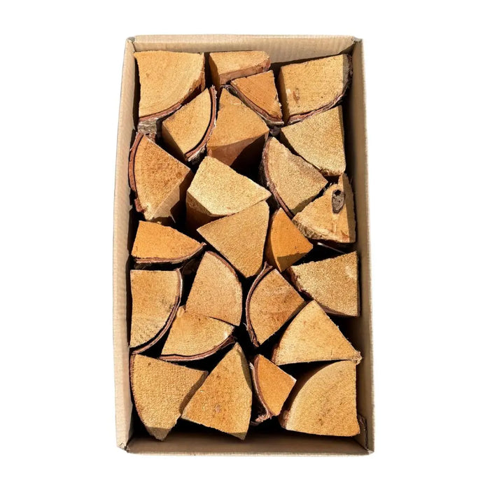 Box of firewood pieces on a white background