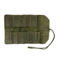 Hide & Drink Tool Roll displays a functional small tool roll-up bag with 10 slots, crafted from durable full grain leather. This portable carry-on pouch is essential for woodworking tools organization at your workshop, promoting effective storage solutions. Hand cut and sewn in La Antigua Guatemala & Oaxaca Mexico, each piece shows artisan quality.