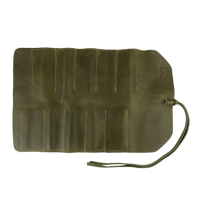Hide & Drink Tool Roll features an elegant small tool roll-up bag with 10 slots, designed in fine full grain leather. Perfect as a portable carry-on pouch for woodworking tools, it enhances workshop storage capabilities. Each handmade item is produced in La Antigua Guatemala & Oaxaca Mexico, emphasizing artisan craftsmanship.